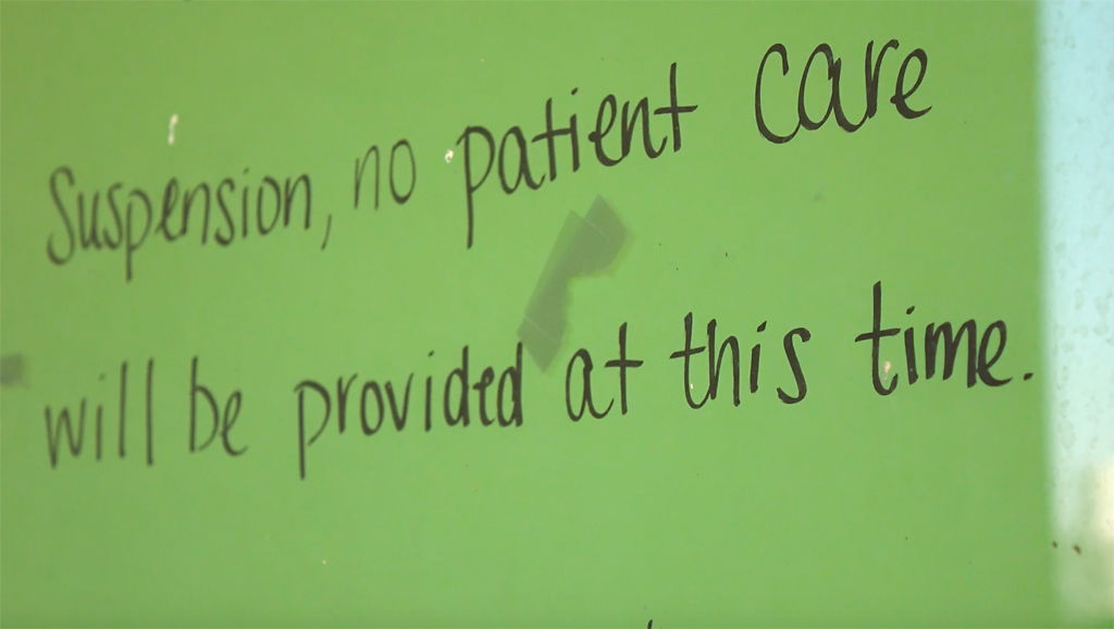 A handmade poster hangs on the door
